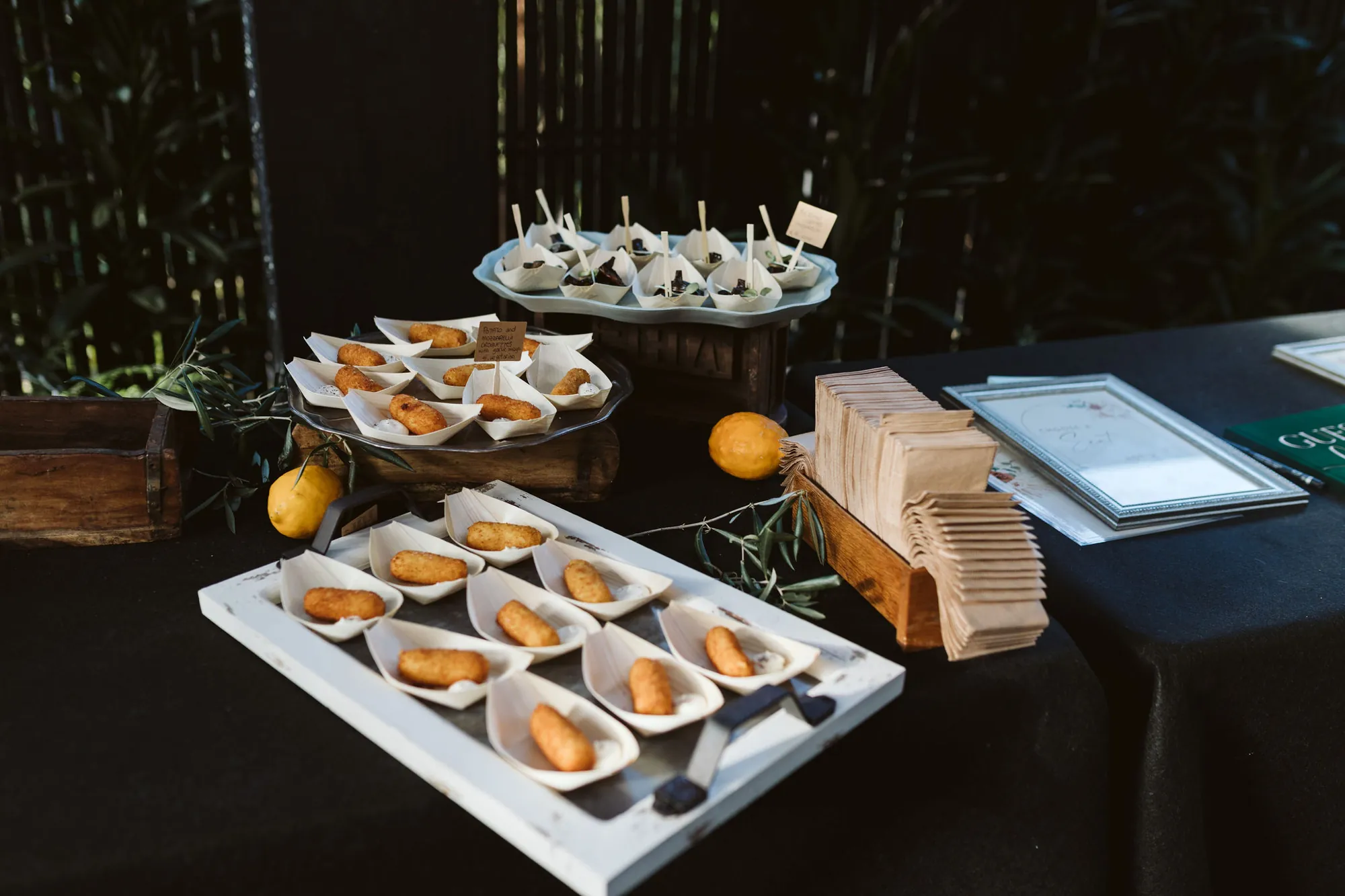Potato and mozzarella croquettes served in wooden boats on the antipasto table