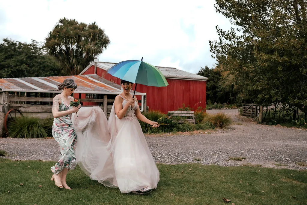 Laura photographed under her veil in a romantic portrait at Waterfall Farm, Kaukapakapa