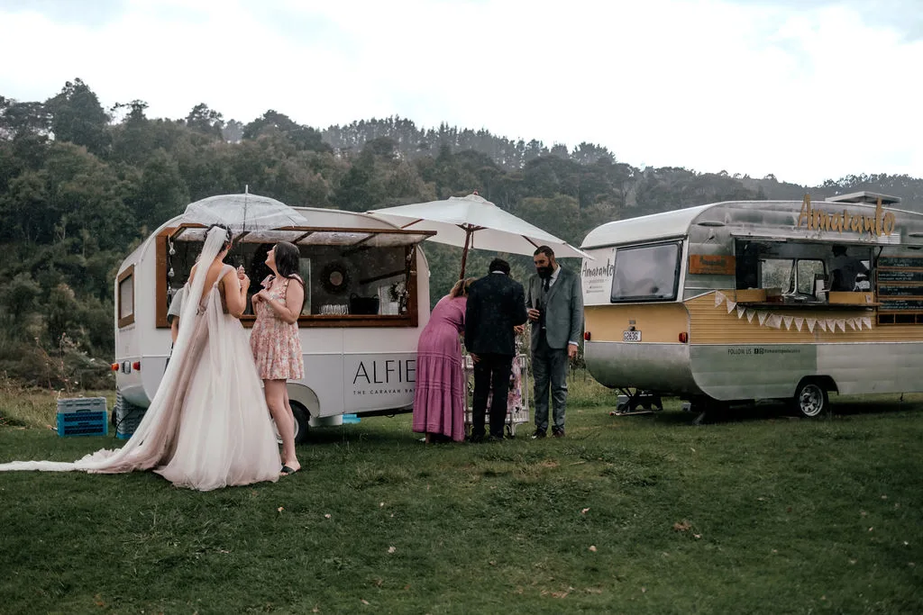 Andrew and Laura at the Amaranto food truck caravan during their wedding reception at Waterfall Farm
