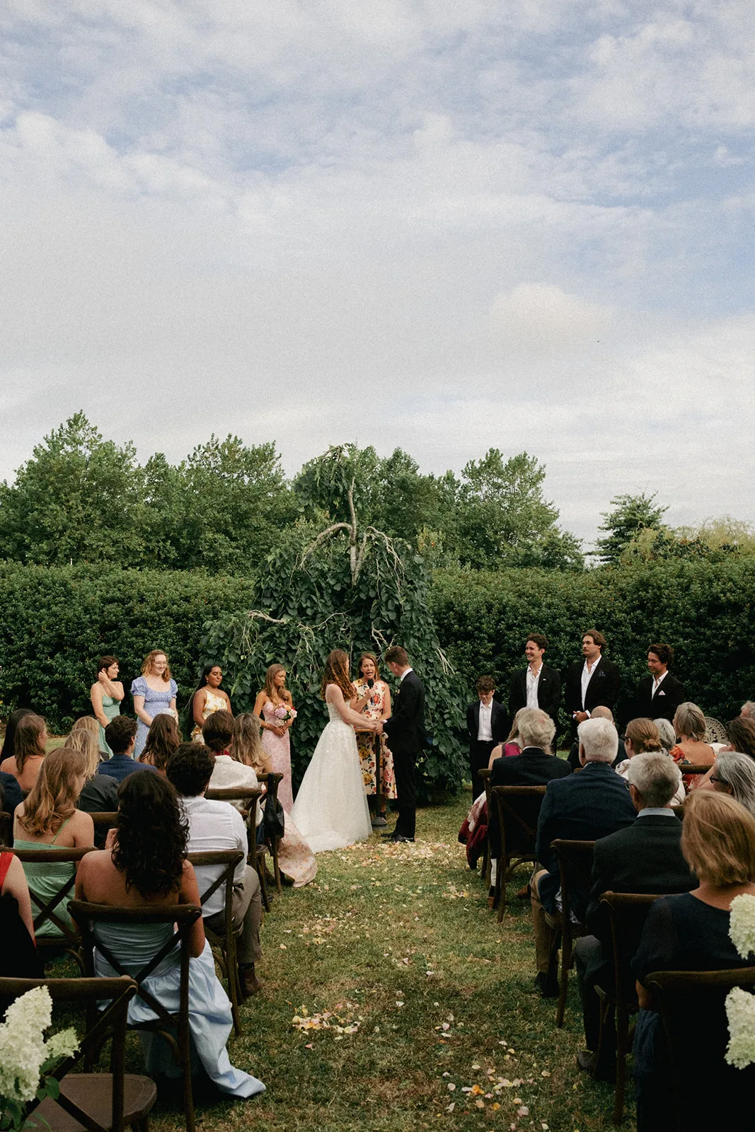 Phaedra and Isaac exchange vows in a garden ceremony at the family home in Matakana