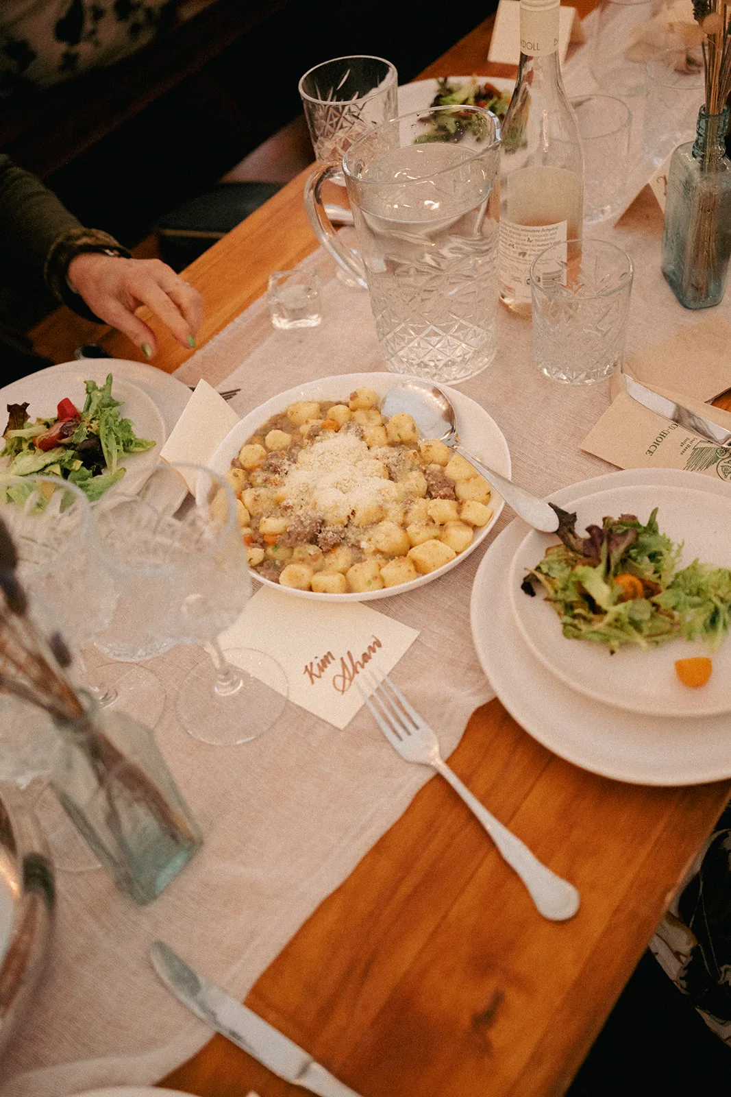 Gnocchi with lamb ragù served family-style on the table at Phaedra and Isaac's wedding in Matakana
