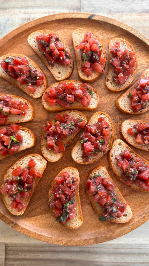 Bruschetta with fresh tomato, olives and homemade basil pesto for a Omaha wedding