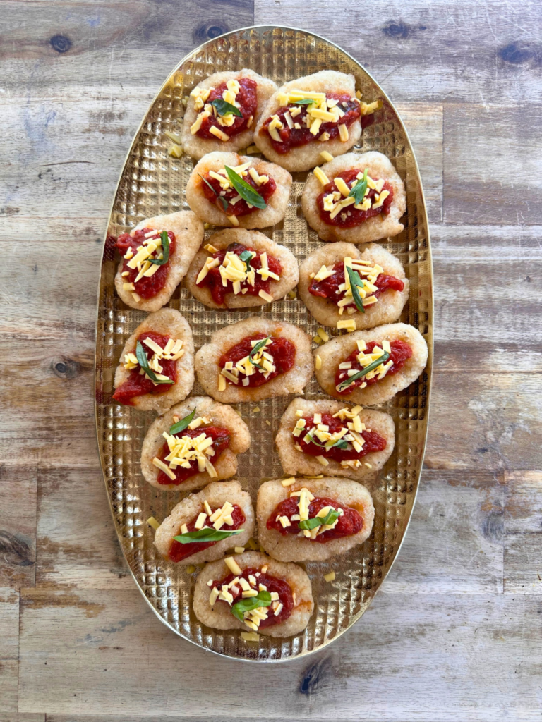 Pizzelle - deep fried sourdough pizza topped with homemade tomato and basil sauce, vegan cheese for vegan wedding